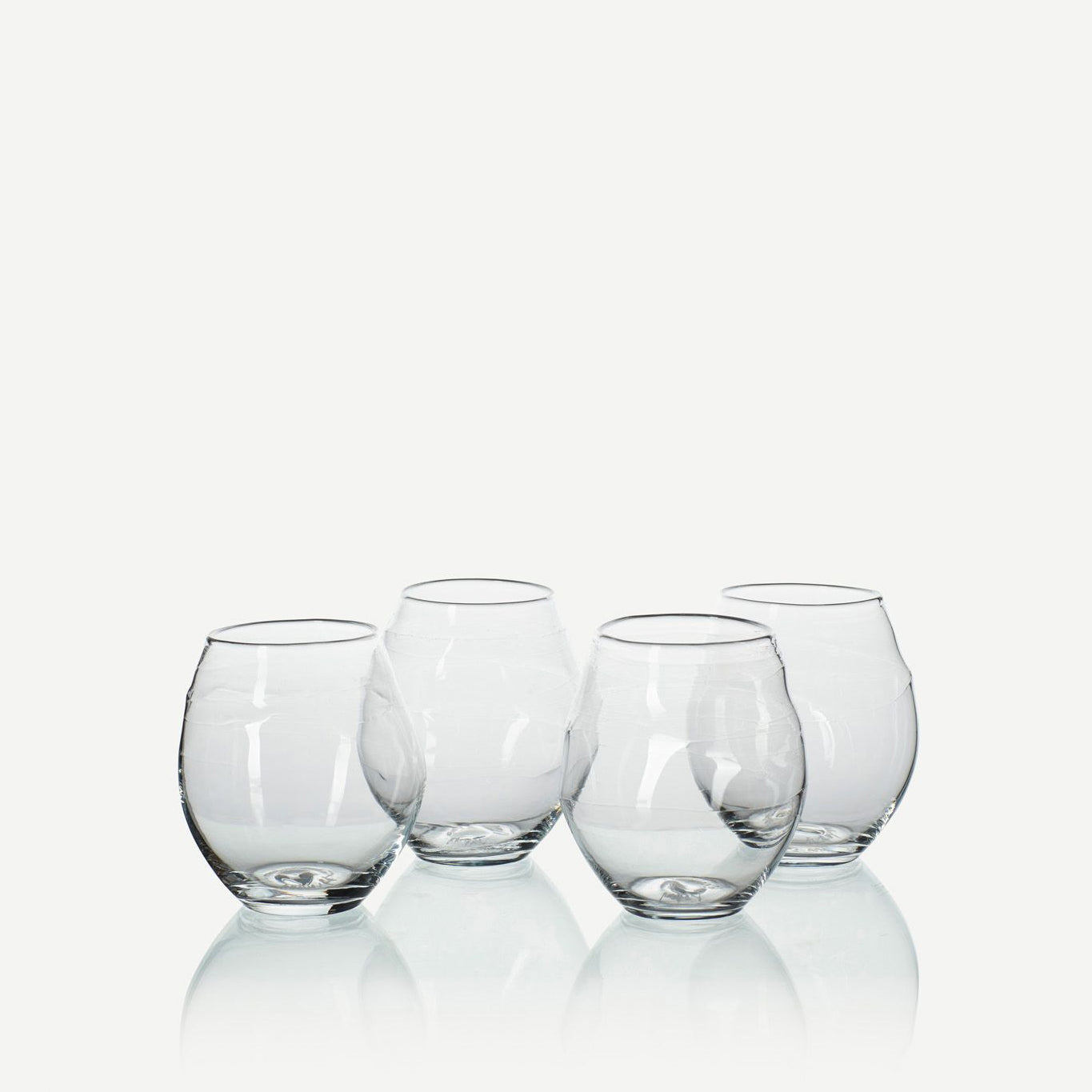 four stemless handblown wine glasses