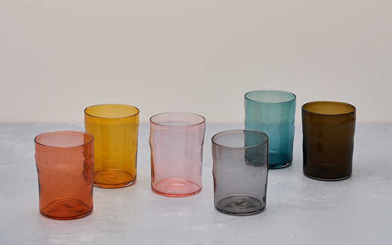 six colored glass tumblers